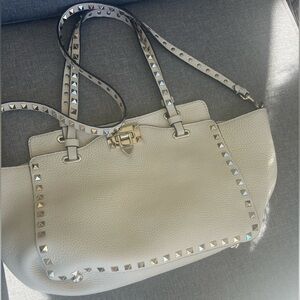Used Valentino Garavani Rockstud Trapeze medium sized tote.
